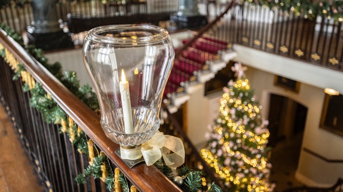 The grand staircase decorated for Christmas at Chirk Castle